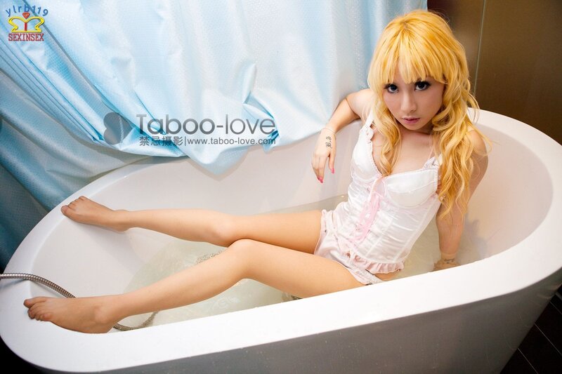 woman in bathtub with blonde hair