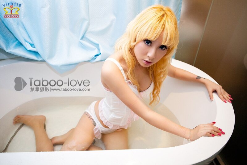 woman in bathtub with blonde hair