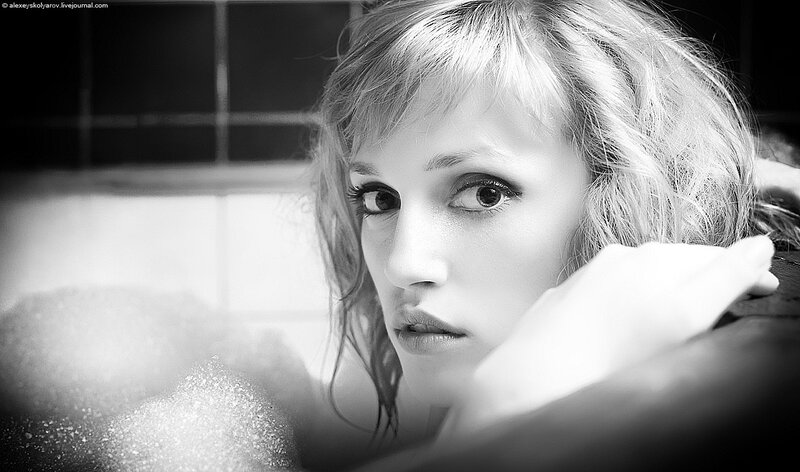 woman in bathtub with bubbles