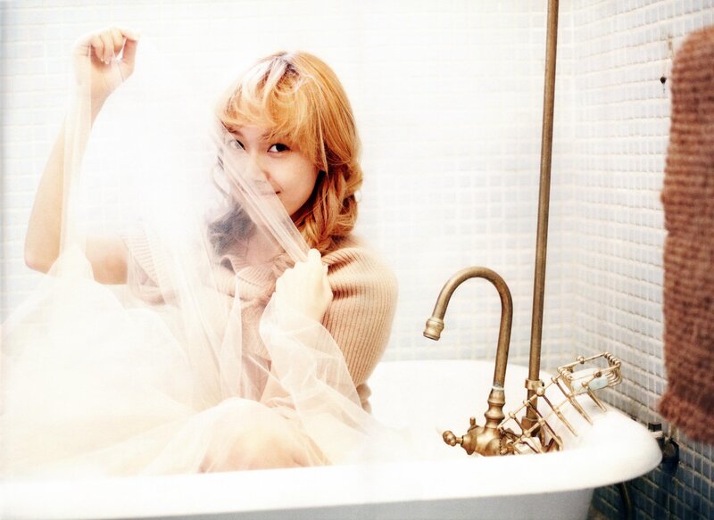 woman in bathtub with veil
