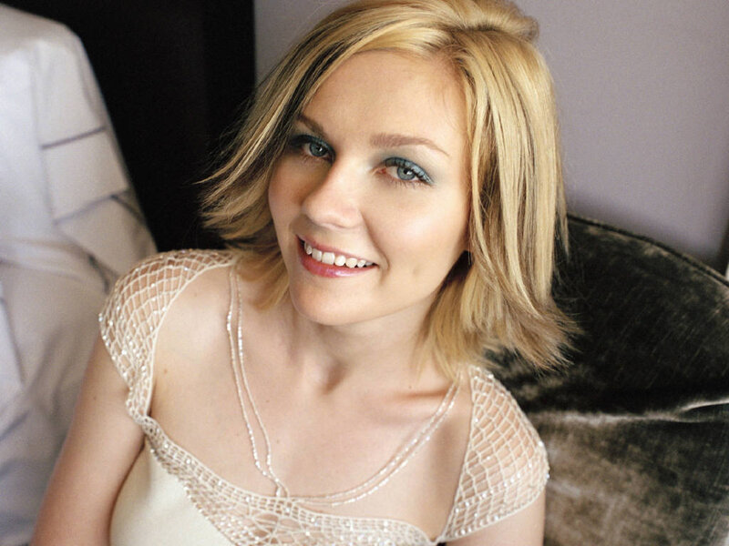 woman in beaded dress smiling