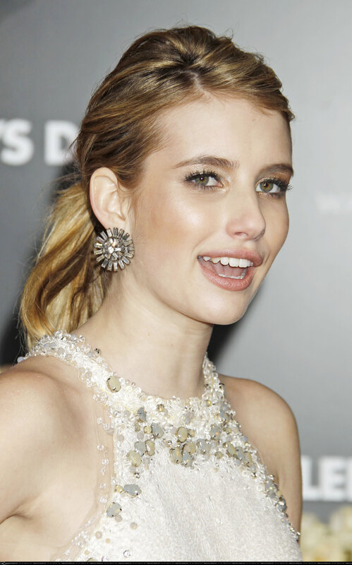 woman in beaded dress smiling