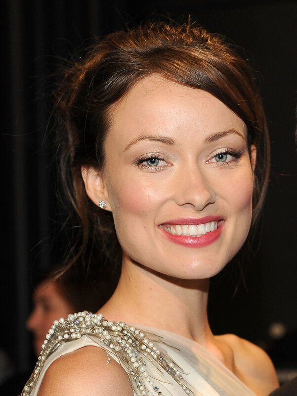 woman in beaded dress smiling