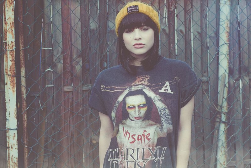 woman in beanie and band t-shirt