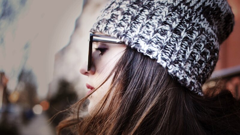 woman in beanie and glasses