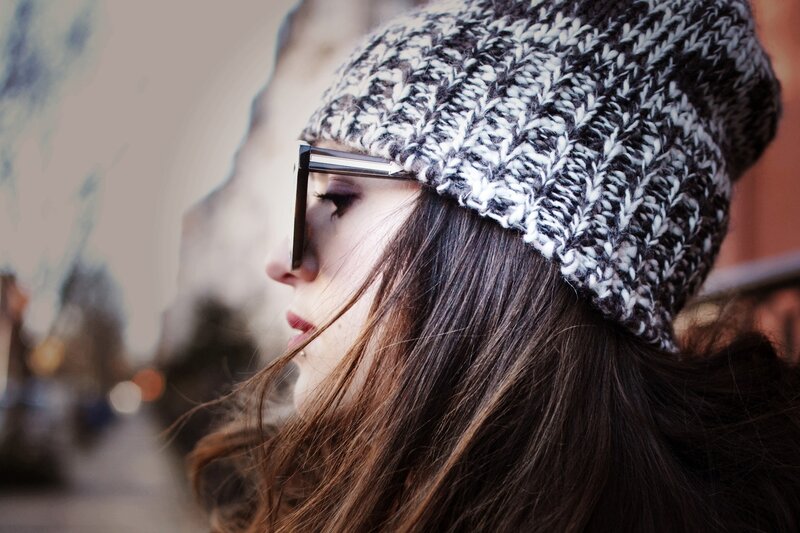 woman in beanie and glasses