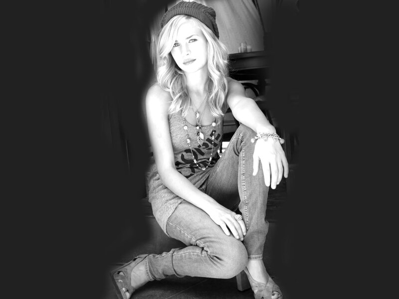 woman in beanie and jeans