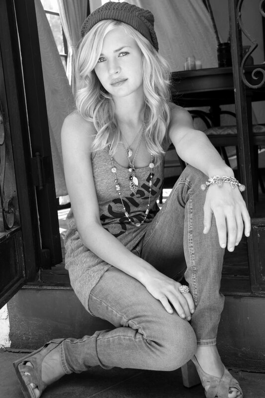 woman in beanie and jeans