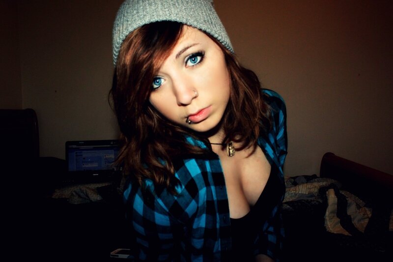 woman in beanie and plaid shirt