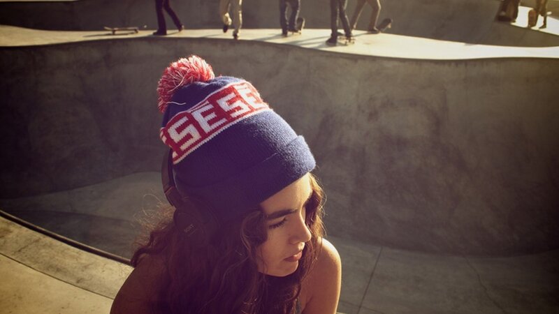 woman in beanie at skatepark