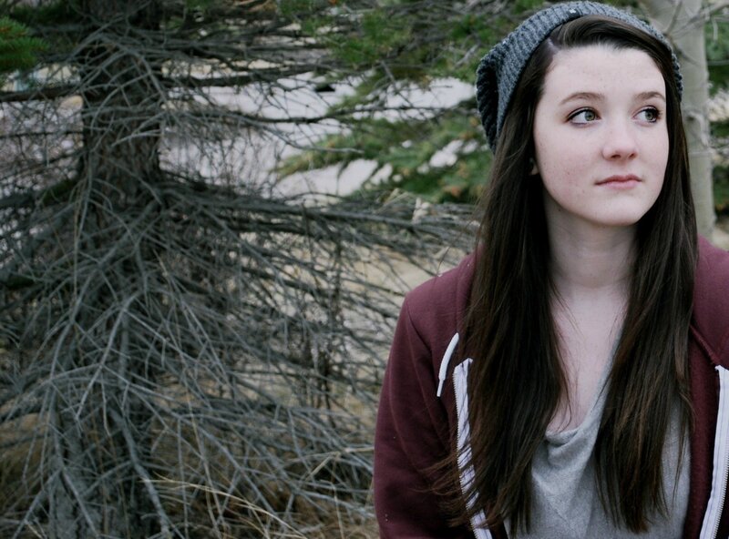 woman in beanie looking away