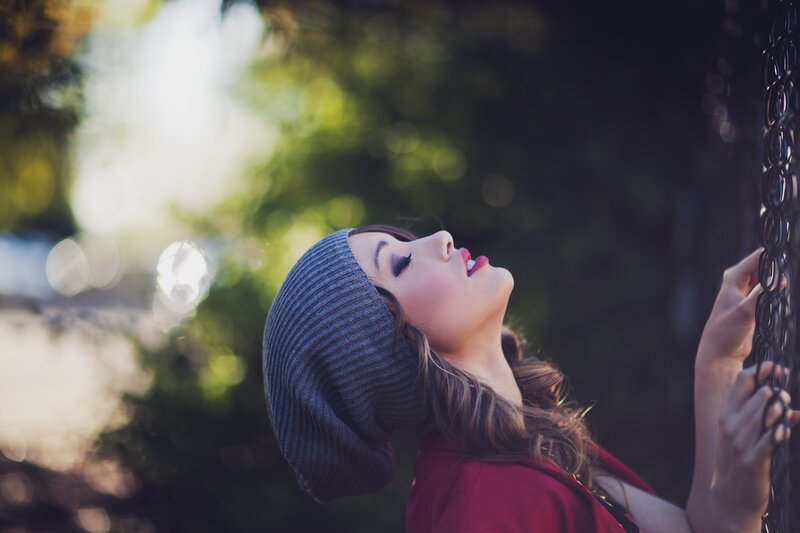 woman in beanie looking up
