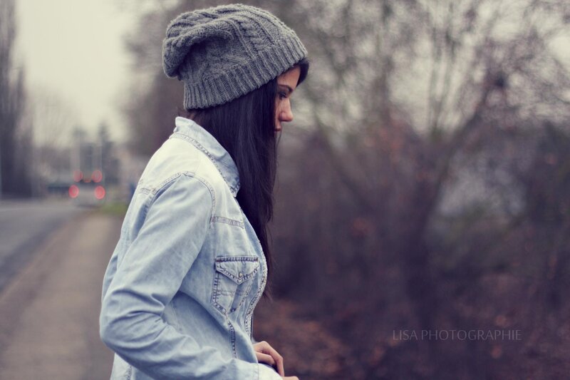woman in beanie on a road