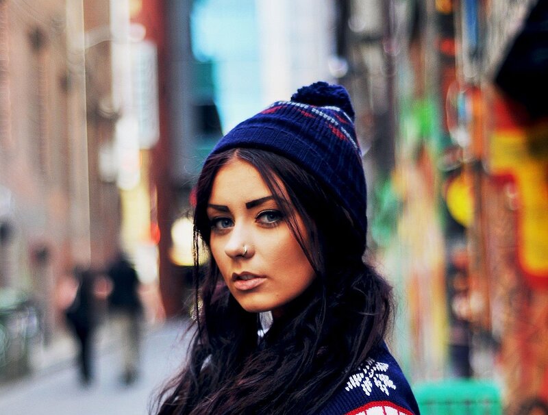 woman in beanie on city street