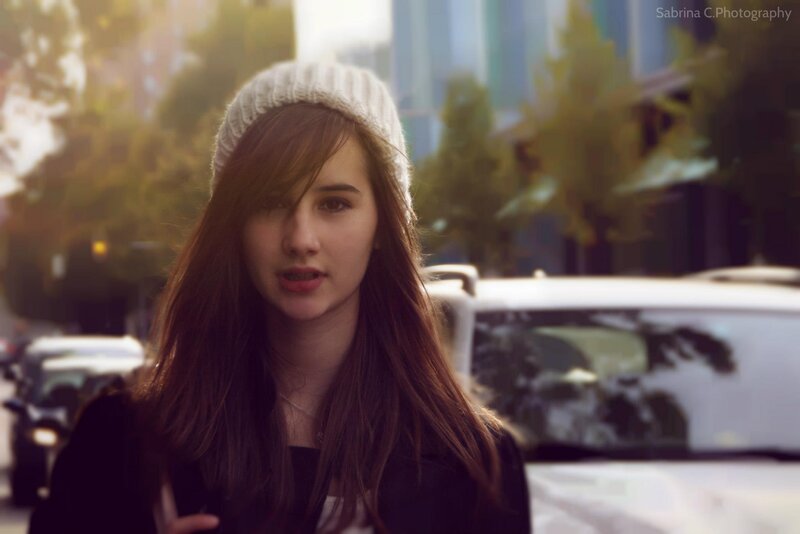 woman in beanie on city street
