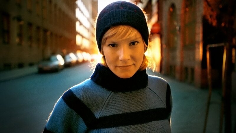 woman in beanie on city street