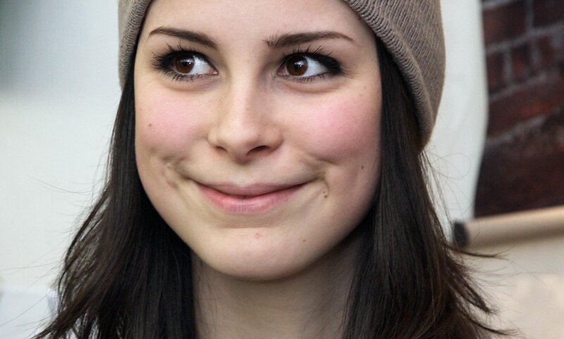woman in beanie smiling