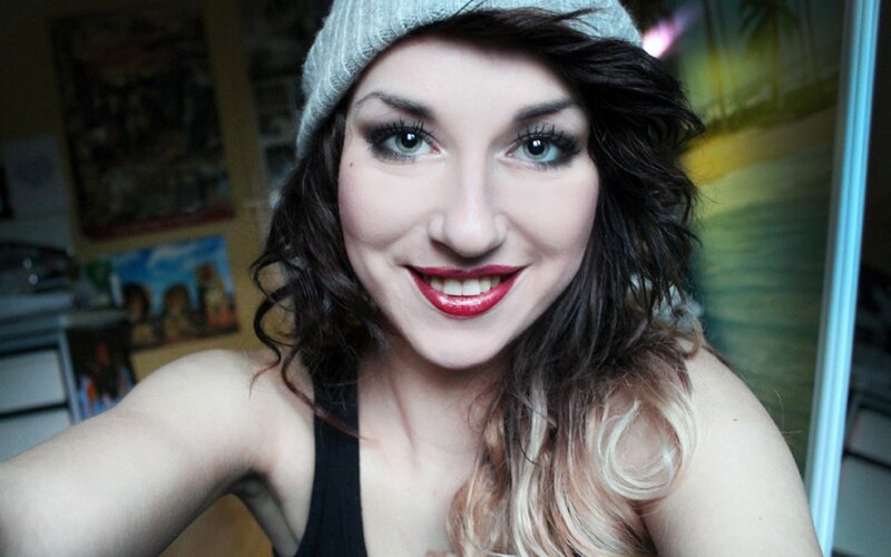 woman in beanie smiling