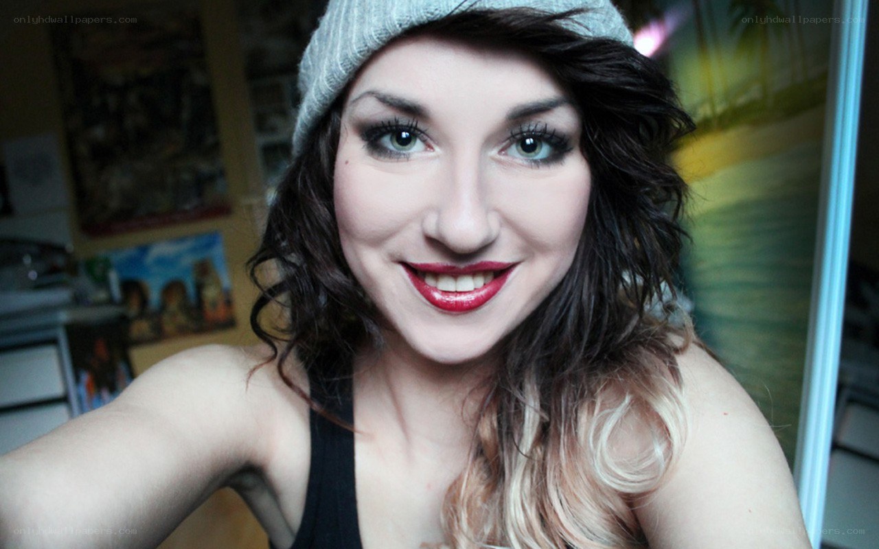 woman in beanie smiling