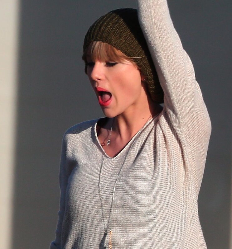 woman in beanie yawning