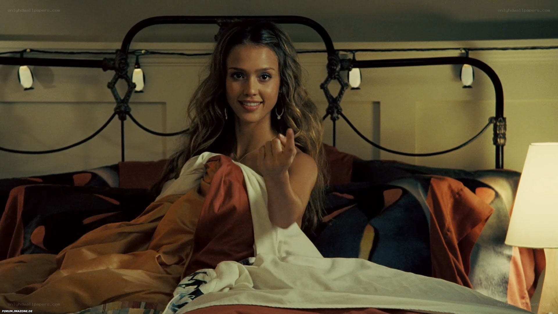 woman in bed smiling
