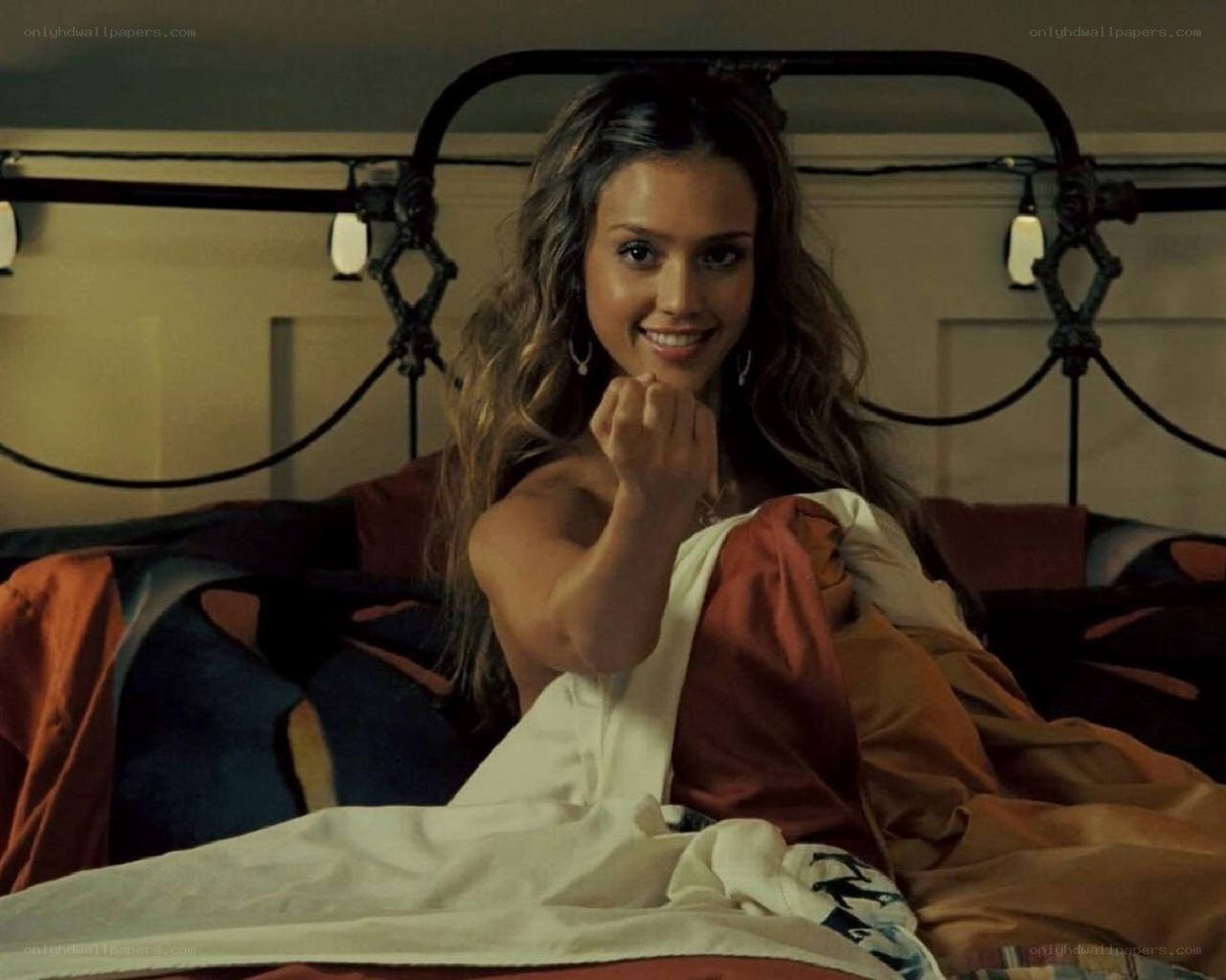 woman in bed smiling