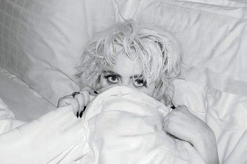woman in bed with blanket