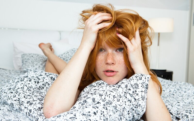 woman in bed with messy hair