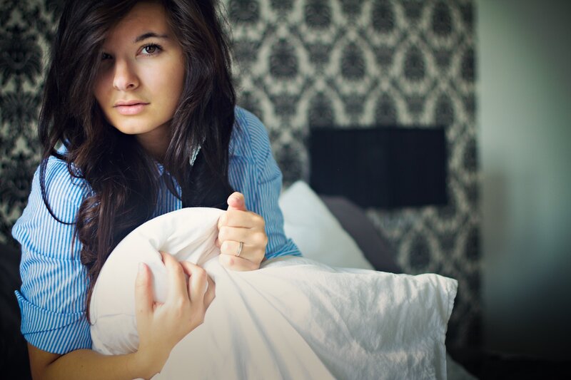 woman in bed with pillow