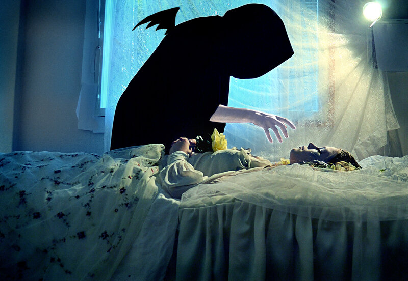 Woman in Bed with Shadow Figure