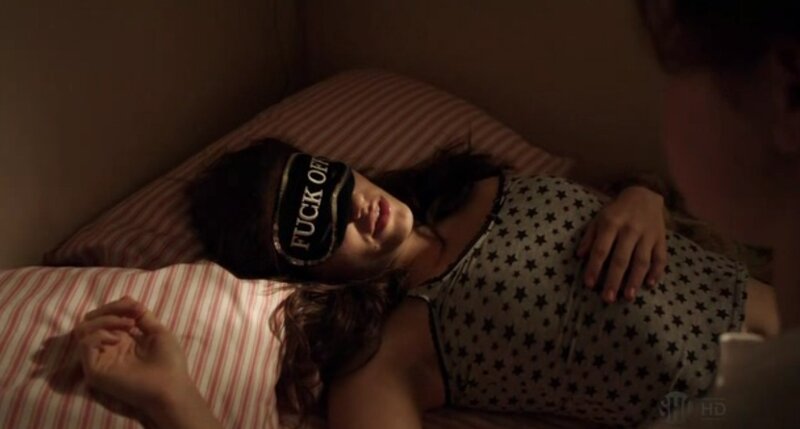 woman in bed with sleep mask