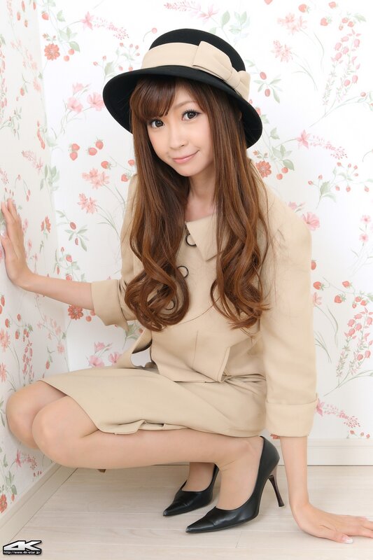woman in beige coat and hat
