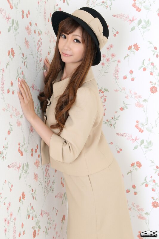 woman in beige coat and hat