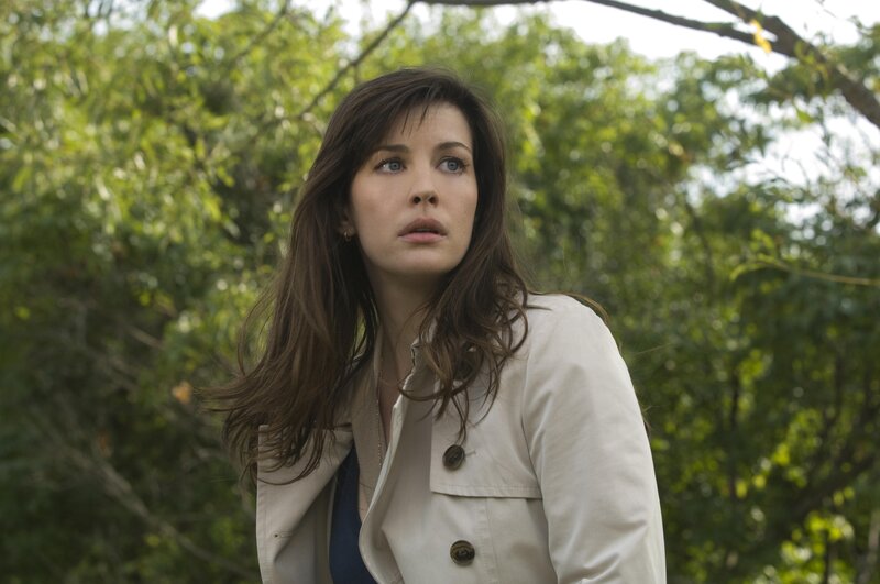 woman in beige coat outdoors