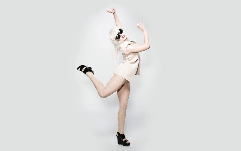 woman in beige dress posing