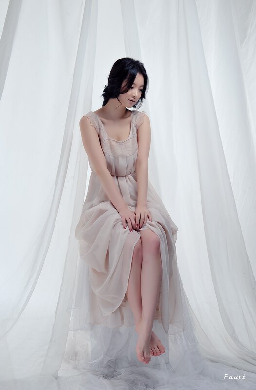 Woman in Beige Dress — White, Serene