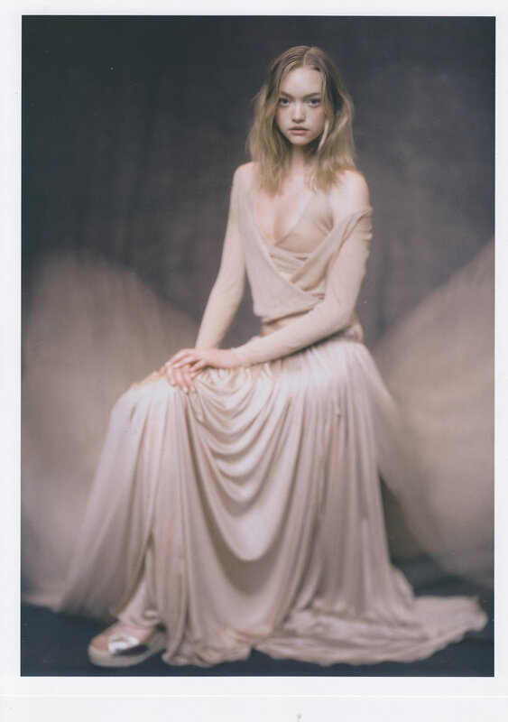 woman in beige gown sitting