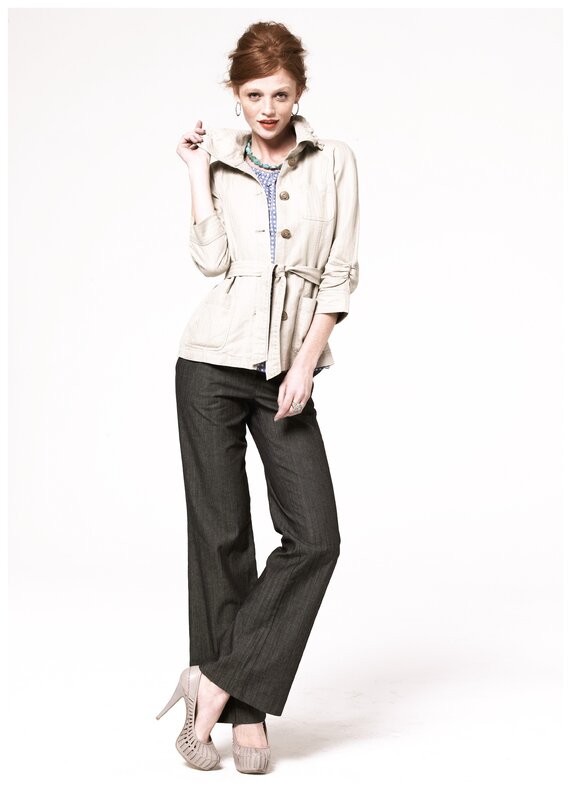 woman in beige jacket and dark pants
