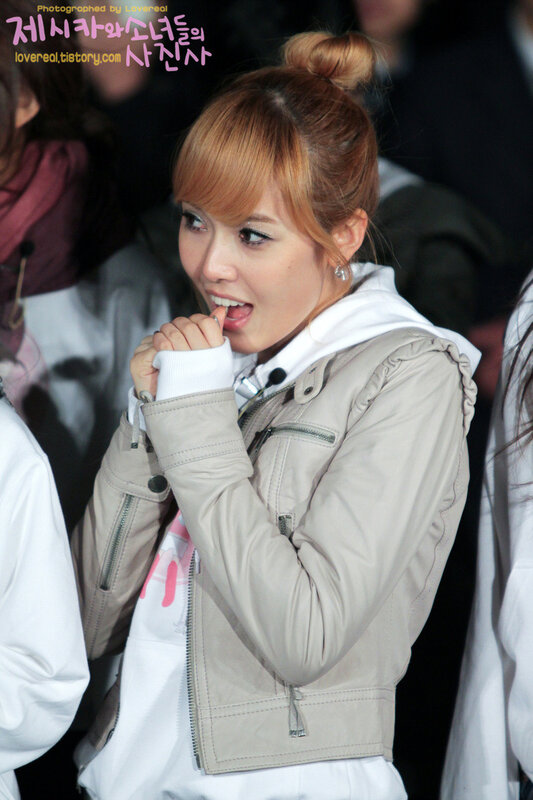 woman in beige jacket smiling