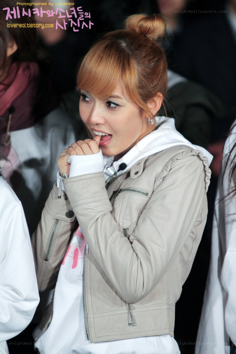 woman in beige jacket smiling