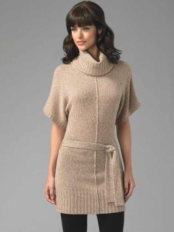 woman in beige knit poncho