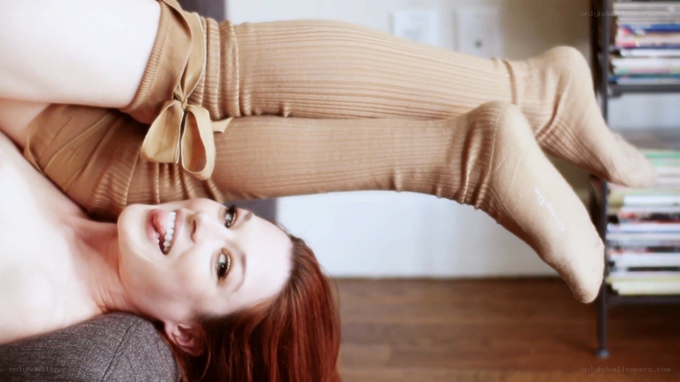 woman in beige socks lying down