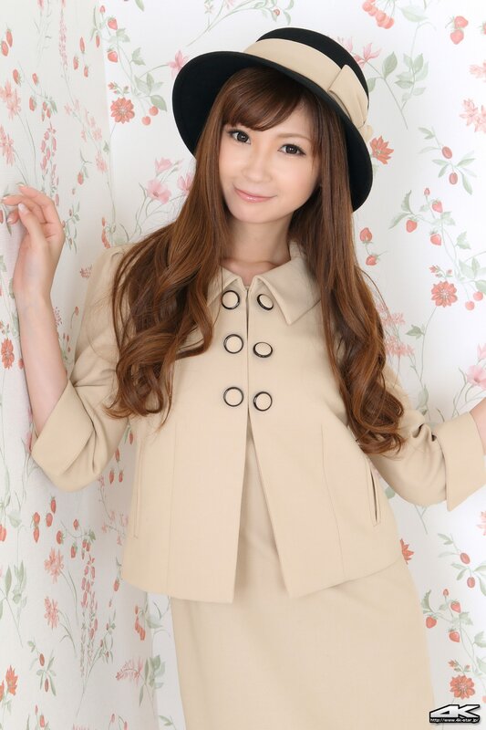 woman in beige suit and hat