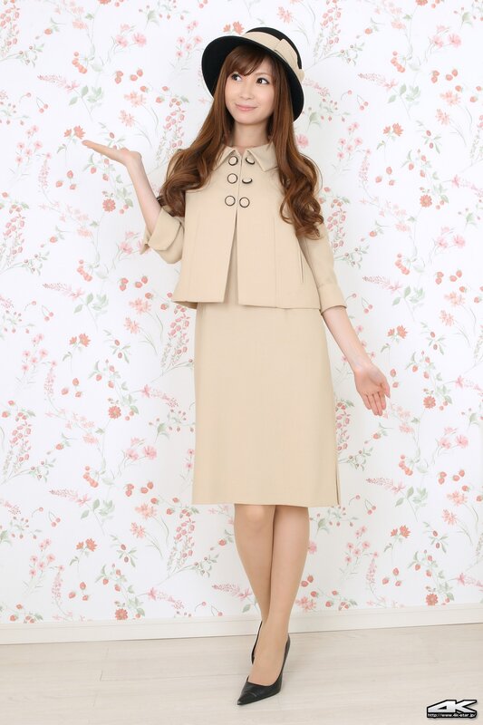 woman in beige suit and hat