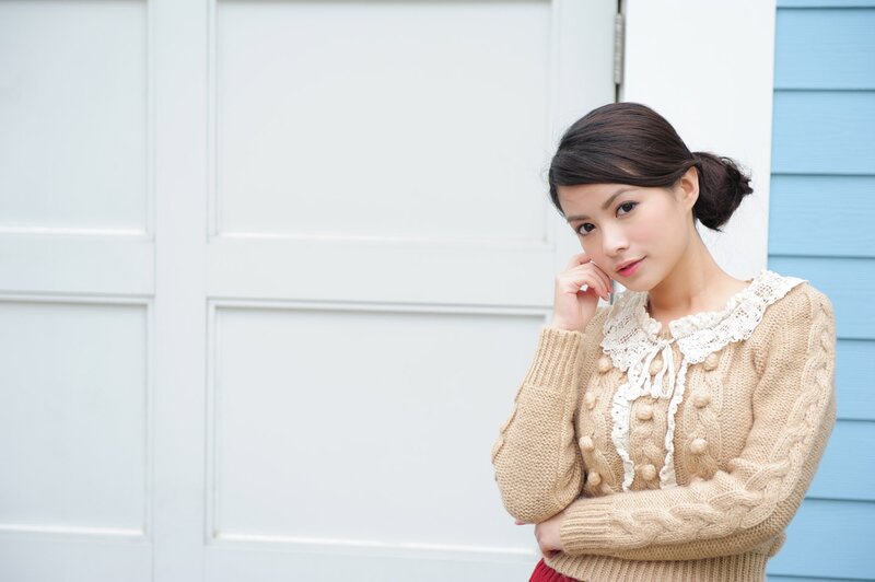 woman in beige sweater