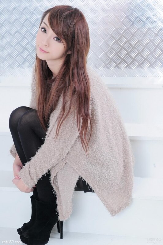 woman in beige sweater sitting