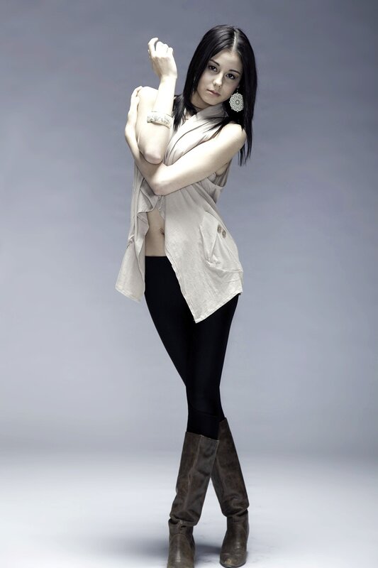 woman in beige top and boots