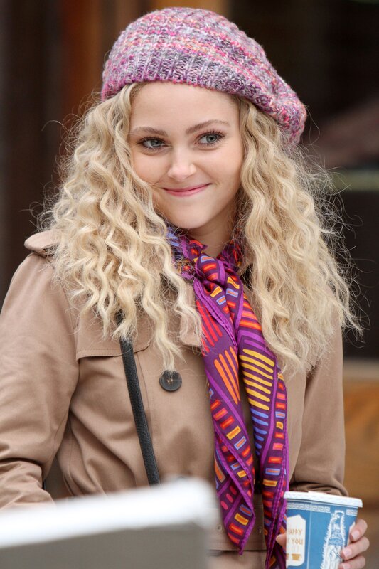 woman in beret holding coffee