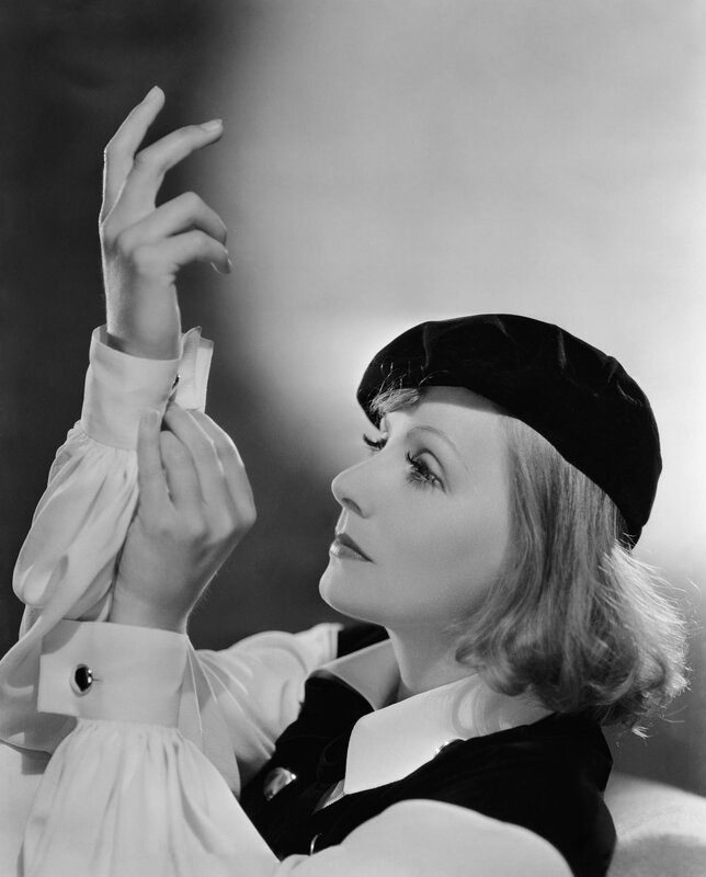 woman in beret looking up
