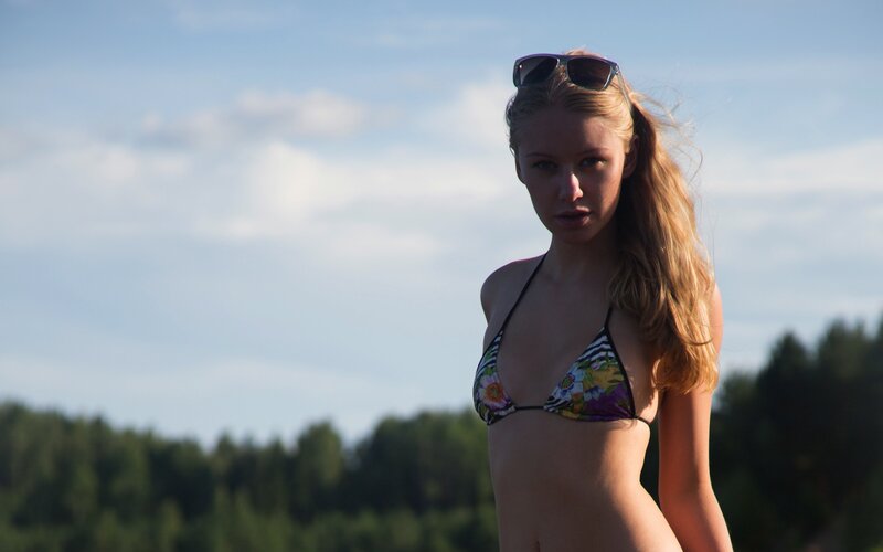 woman in bikini at lake